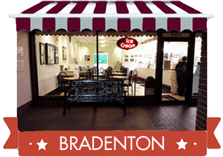 red awning with photo of bradenton location and red banner